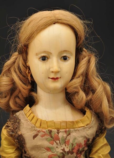 UNUSUAL EARLY CARVED IVORY DOLL.                  