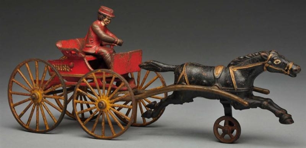 CAST IRON HUBLEY FIRE CHIEF HORSE-DRAWN TOY.      