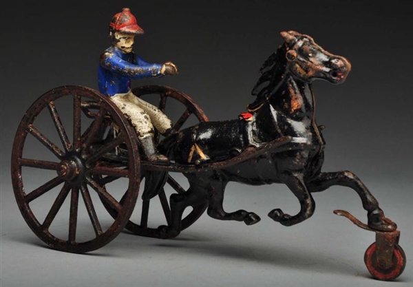 CAST IRON SULKY HORSE-DRAWN TOY.                  