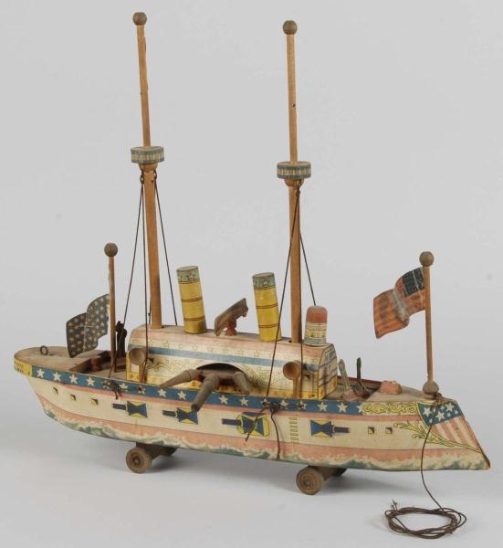 EARLY PAPER ON WOOD BATTLESHIP TOY.               