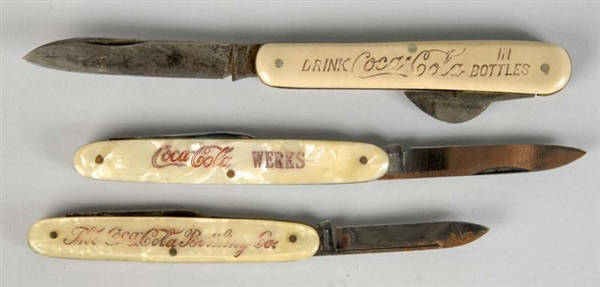 LOT OF 3: ASSORTED COCA-COLA POCKET KNIVES.       