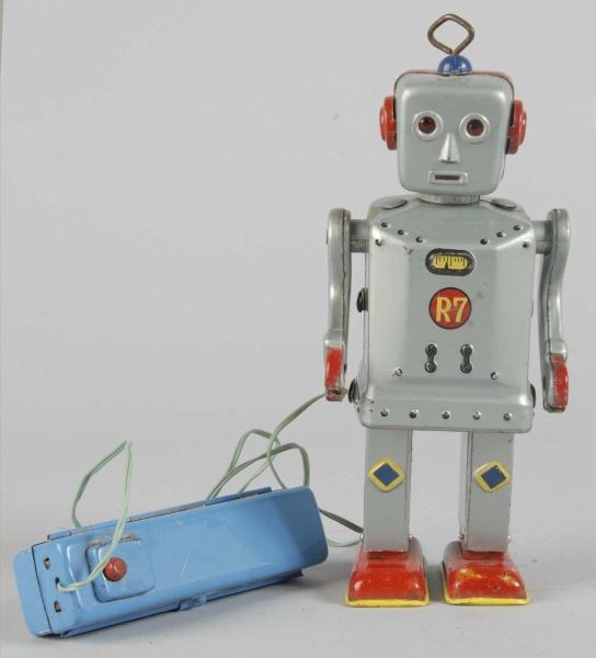 TIN FLASHY JIM R7 ROBOT BATTERY-OPERATED TOY.     