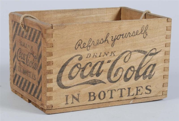 WOODEN COCA-COLA CARRIER WITH CORD HANDLE.        