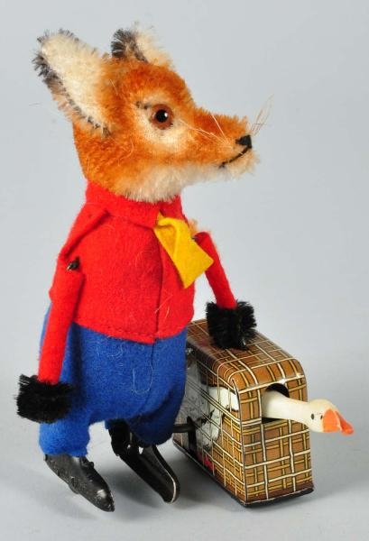 SCHUCO FOX CARRYING GOOSE WIND-UP TOY.            
