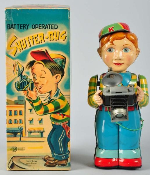 TIN SHUTTER-BUG BATTERY-OPERATED TOY.             