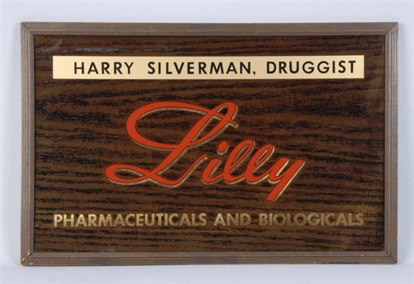 REVERSE GLASS LILLY DRUG STORE SIGN.              
