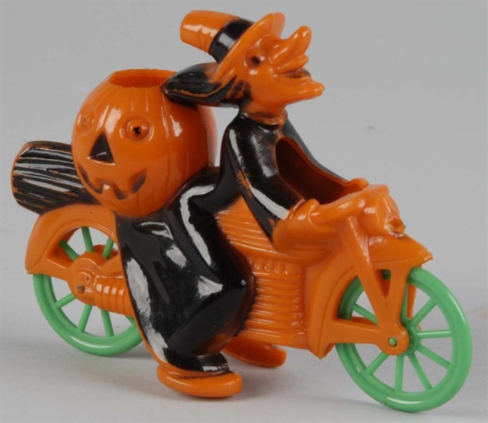 PLASTIC HALLOWEEN WITCH ON MOTORCYCLE.            