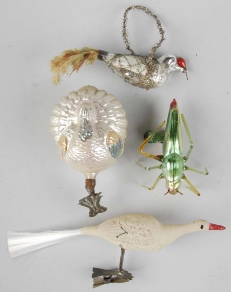 LOT OF 4: GLASS CHRISTMAS FIGURAL ORNAMENTS.      