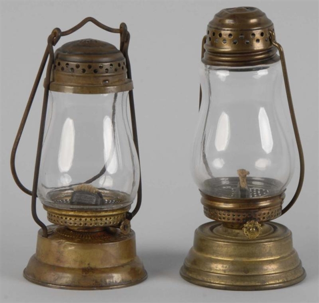 PAIR OF SKATERS BRASS OIL LAMPS.                 