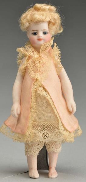 FRENCH BISQUE “MIGNONNETTE” DOLL WITH BARE FEET.  