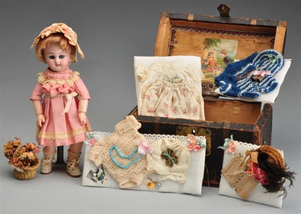 FRENCH 749 CHILD DOLL WITH TRUNK.                 