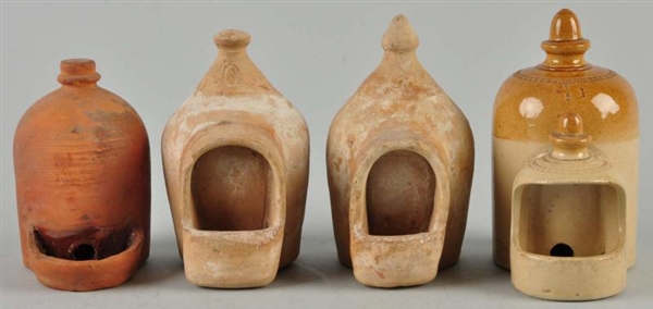 LOT OF 4: SMALL POTTERY CHICKEN FEEDERS.          