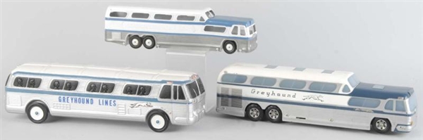 LOT OF 3: PLASTIC GREYHOUND BUS TOYS.             