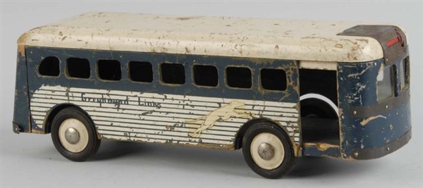 WOODEN GREYHOUND LINES BUS PUSH TOY.              