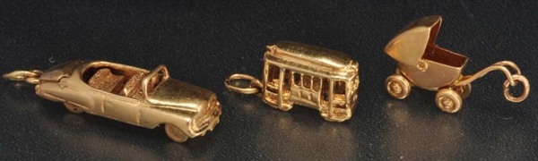LOT OF 3: 14K Y. GOLD CHARMS.                     