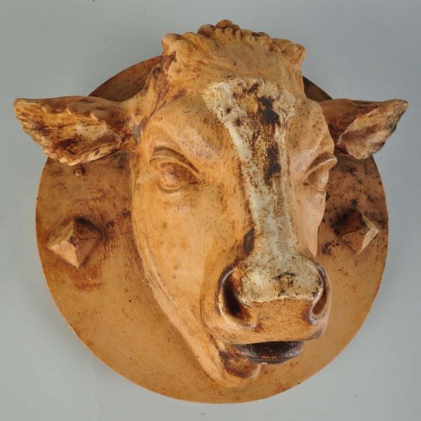 CAST IRON PAINTED COW HEAD HANGING RELIEF PLAQUE. 
