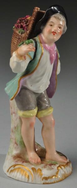 MEISSEN BOY CARRYING BASKET WITH GRAPES.          