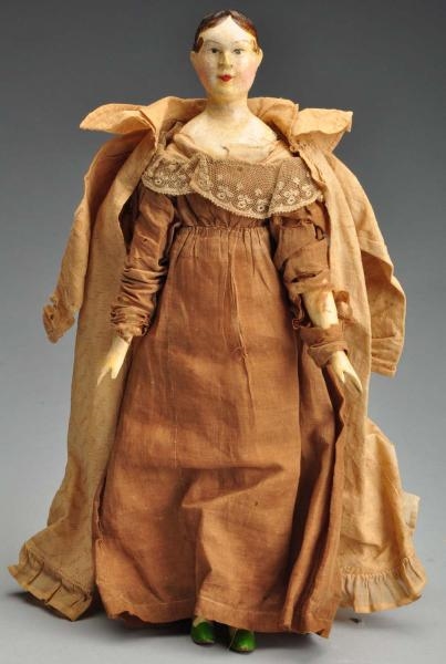 RARE EARLY CARVED WOOD DOLL.                      