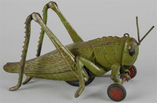 CAST IRON HUBLEY GRASSHOPPER TOY.                 