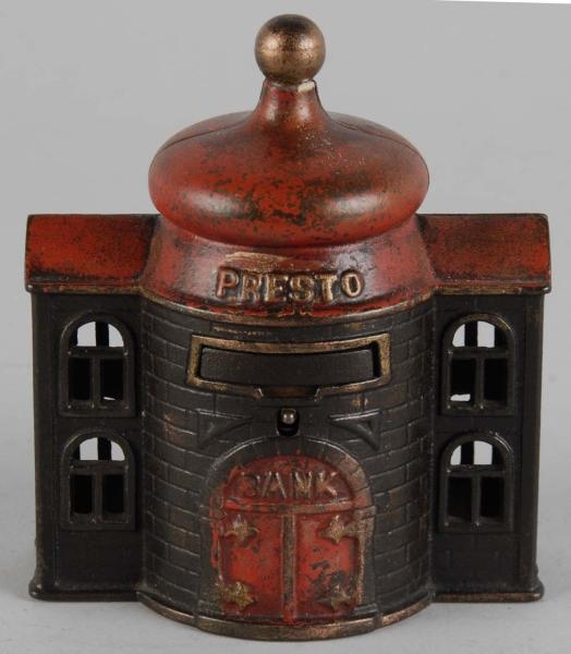 CAST IRON PRESTO MECHANICAL BANK.                 