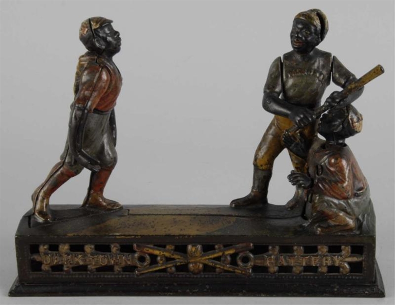 CAST IRON DARKTOWN BATTERY MECHANICAL BANK.       