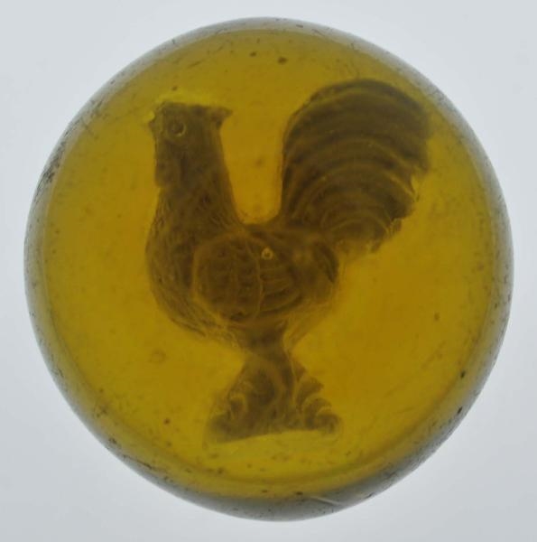 HONEY AMBER ROOSTER SULPHIDE MARBLE.              