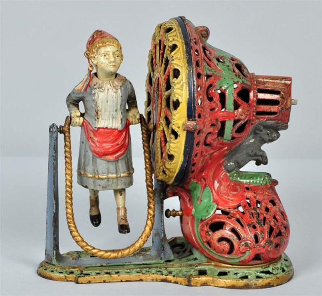 CAST IRON GIRL SKIPPING ROPE MECHANICAL BANK.     