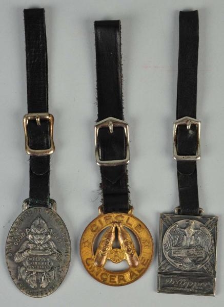 LOT OF 3: ASSORTED WATCH FOBS.                    