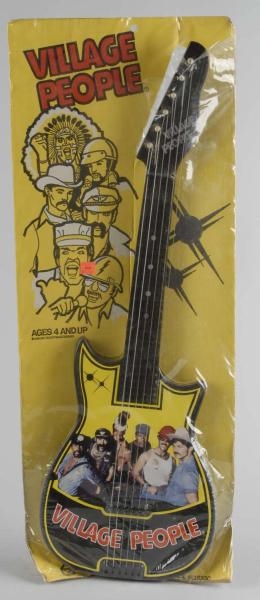 VINTAGE CARNIVAL TOYS VILLAGE PEOPLE GUITAR TOY.  