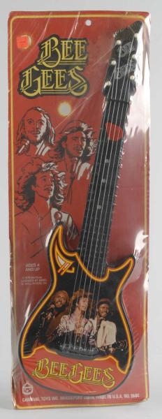 VINTAGE CARNIVAL TOYS BEE GEES GUITAR TOY.        