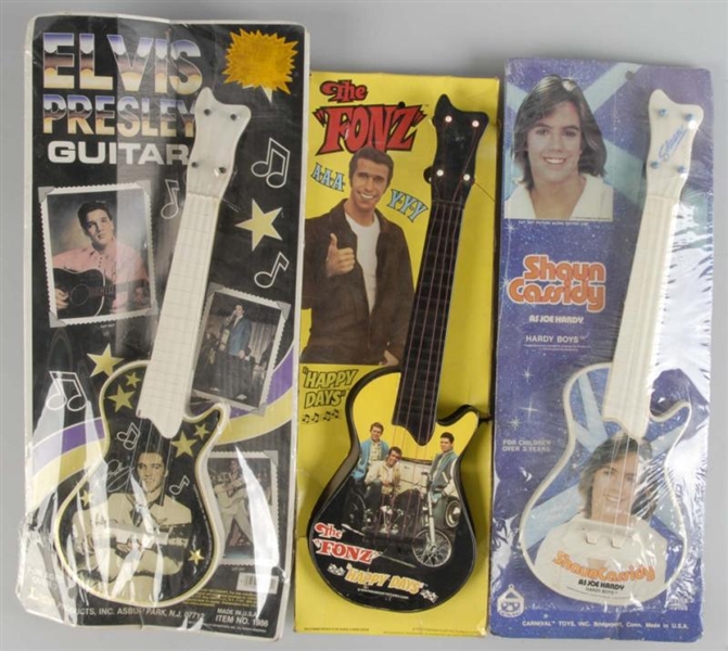 LOT OF 3: VINTAGE CHARACTER GUITAR TOYS.          