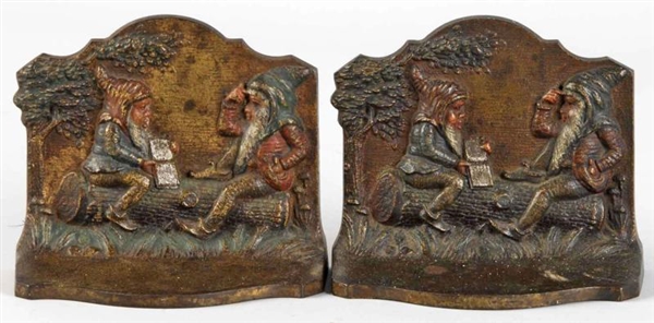 PAIR OF CAST IRON READING GNOMES BOOKENDS.        