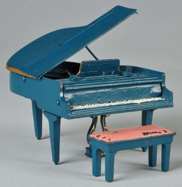 CAST IRON ARCADE BABY GRAND PIANO & BENCH TOY.    