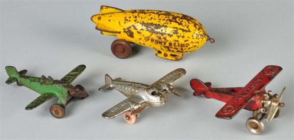 LOT OF 4: CAST IRON AVIATION TOYS.                