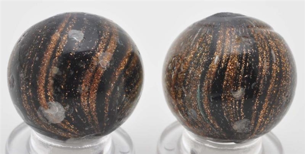 LOT OF 2: BLACK GLASS LUTZ MARBLES.               