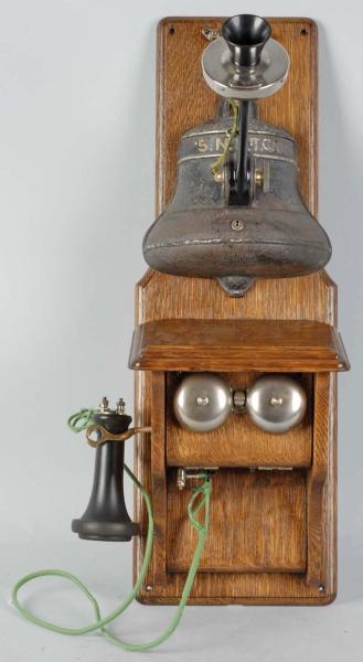 GRAY BELL-SHAPED COIN COLLECTOR TELEPHONE.        