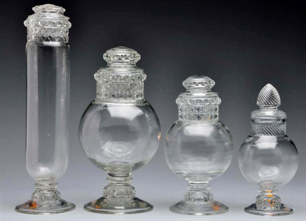 LOT OF 4: GLASS APOTHECARY CANDY JARS WITH LIDS.  