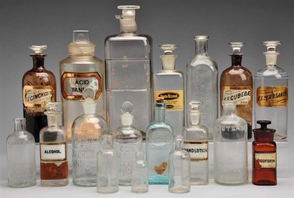 LOT OF 18: MEDICINE BOTTLES WITH STOPPERS.        