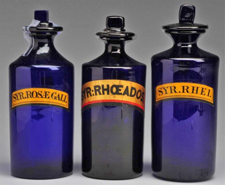 LOT OF 3: ROUND COBALT GLASS SYRUP BOTTLES.       