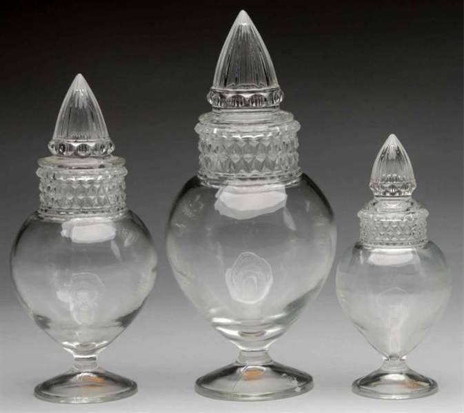 LOT OF 3: HECK SPIRED URN CLEAR APOTHECARY JARS.  