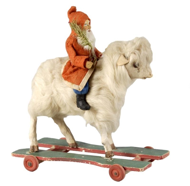 LARGE SANTA RIDING A WHITE GOAT PULL TOY.         