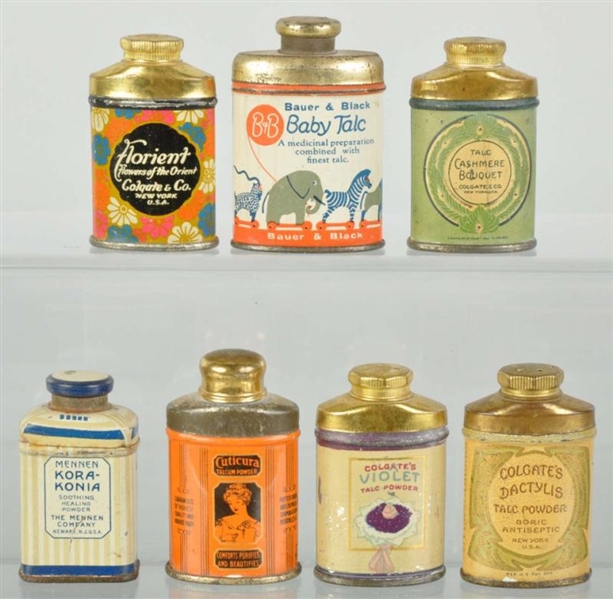 LOT OF 7: ASSORTED SAMPLE TALC TINS.              