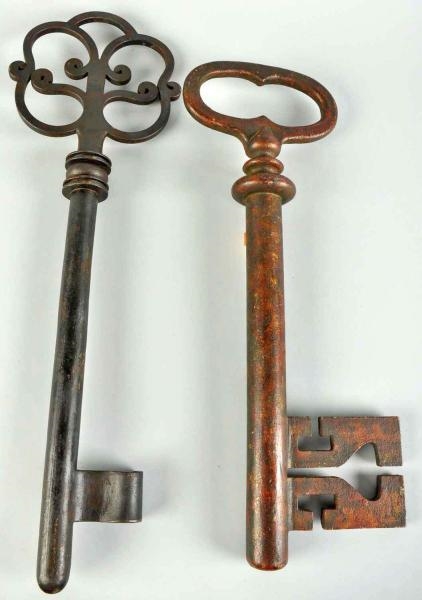 LOT OF 2: EARLY IRON TRADE SIGN KEYS.             