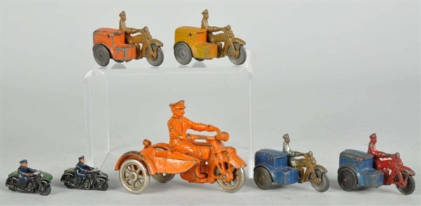 LOT OF 7: CAST IRON & POT METAL MOTORCYCLE TOYS.  