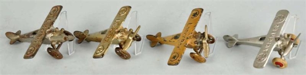 LOT OF 4: CAST IRON AIRPLANE TOYS.                