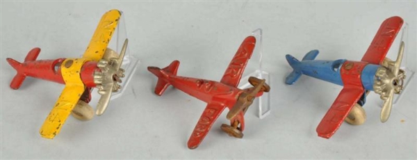 LOT OF 3: CAST IRON AIRPLANE TOYS.                