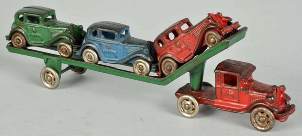 CAST IRON CAR CARRIER TOY.                        