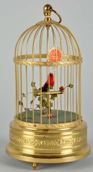 MUSICAL BIRD IN CAGE WIND-UP TOY.                 