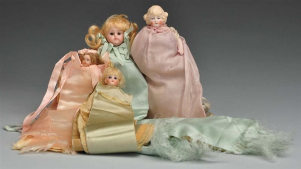 LOT OF 4: ALL BISQUE DOLLS.                       