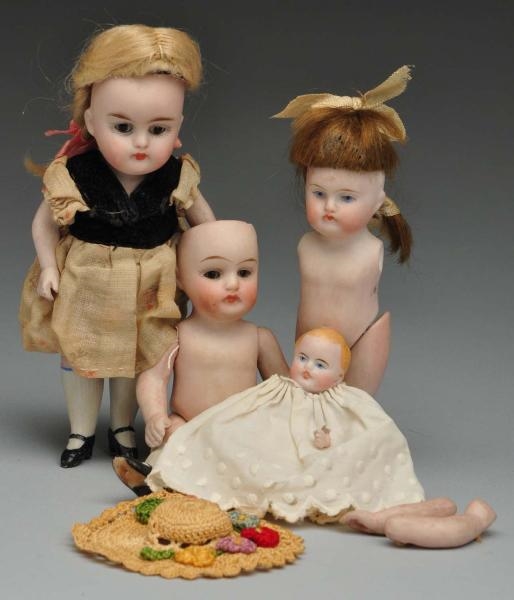 LOT OF 4: GERMAN ALL BISQUE DOLLS.                